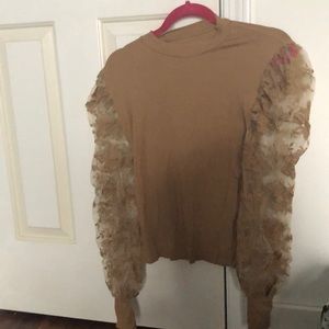 Tan lace sleeve turtleneck.